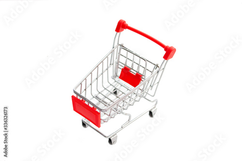 red toy shopping cart isolated on white background