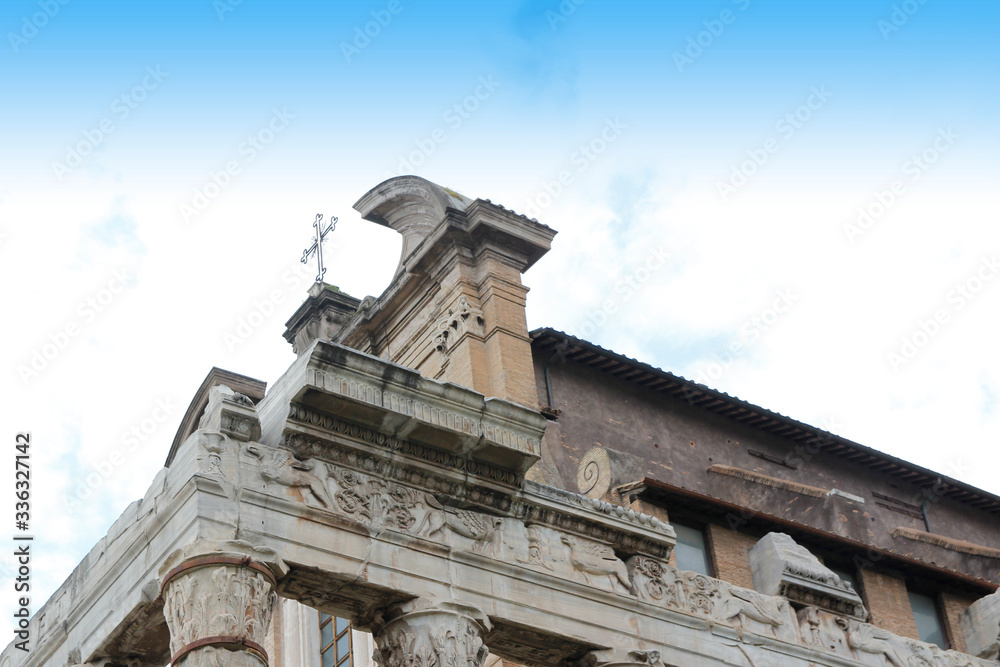 Christian cross on top of Temple of Antoninus and Faustina in Roman Forum, Rome, Italy