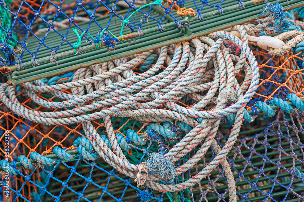 Lobster pots and rope on a harbor quayside