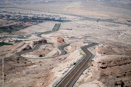 aerial view of highway in mountains