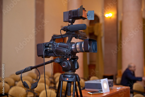 Professional production video camera. video camera set on a tripod with excellent clipping path .