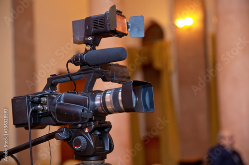 Professional production video camera. video camera set on a tripod with excellent clipping path .