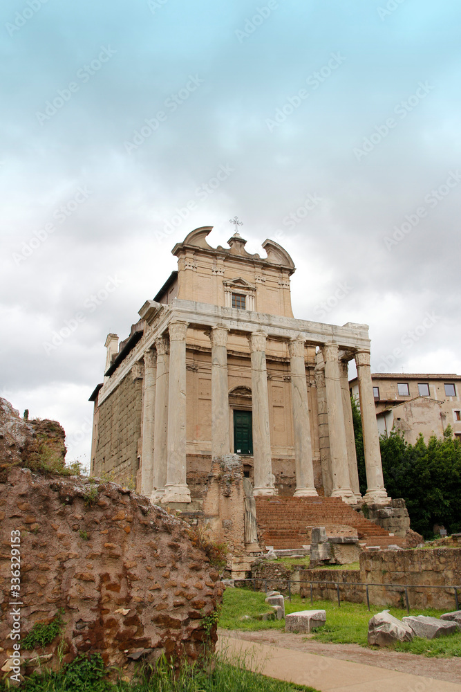 Temple of Antoninus and Faustina during sunset in Roman Forum, Rome, Italy