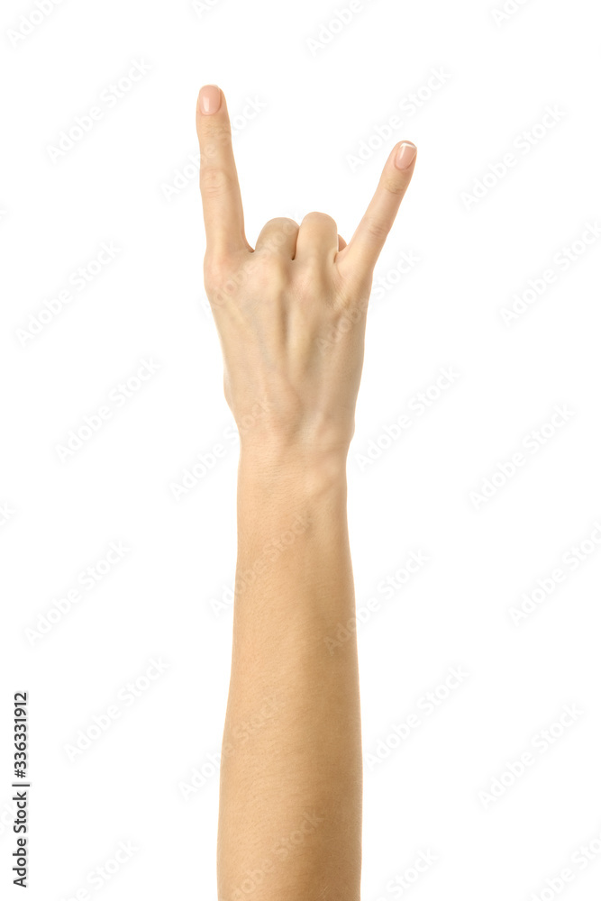 Rock and roll! Woman hand gesturing isolated on white Rock and roll! Woman hand gesturing isolated on white