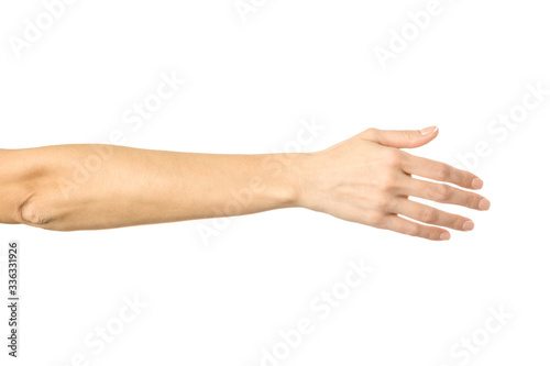 Giving hand for handshake. Woman hand gesturing isolated on white photo