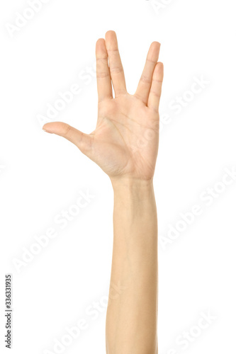 Fototapeta Vulcan salute. Woman hand gesturing isolated on white