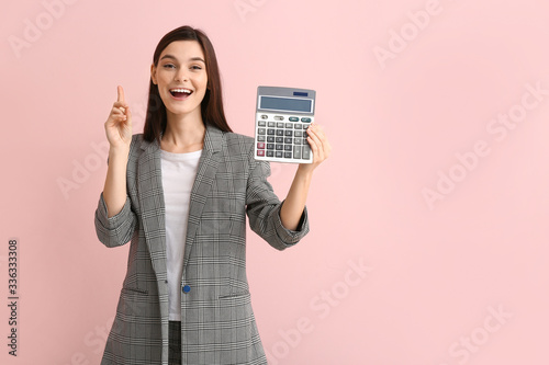 Young woman with calculator...