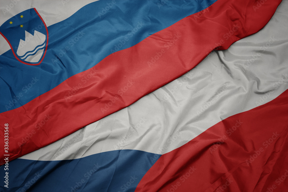 waving colorful flag of czech republic and national flag of slovenia. waving colorful flag of czech republic and national flag of slovenia.