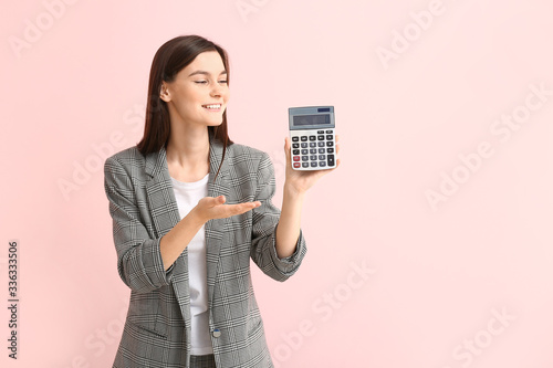 Young woman with calculator...