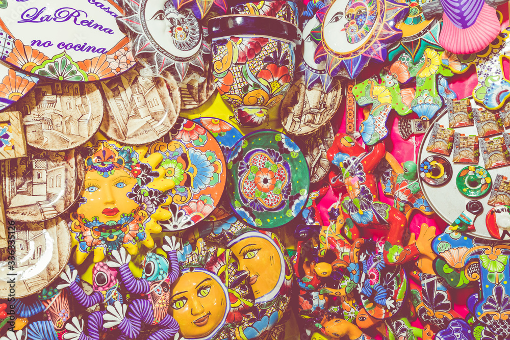 Colorful traditional Mexican pottery. Talavera style. Souvenirs on sale in local market of Guanajuato, Mexico.