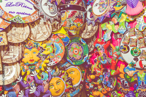 Colorful traditional Mexican pottery. Talavera style. Souvenirs on sale in local market of Guanajuato, Mexico.