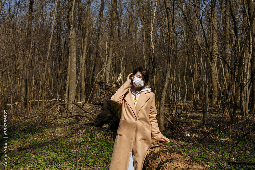 Self isolation. Masked walk in nature. virus attack Self isolation. Masked walk in nature. virus attack