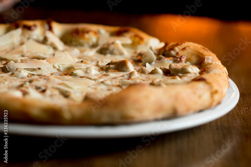 Pizza with cheese and chick...