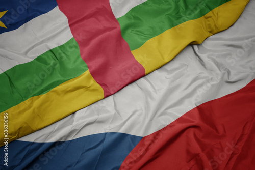 waving colorful flag of czech republic and national flag of central african republic.