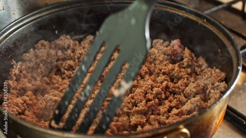 Minced pork fried in a pan mixing Close Up