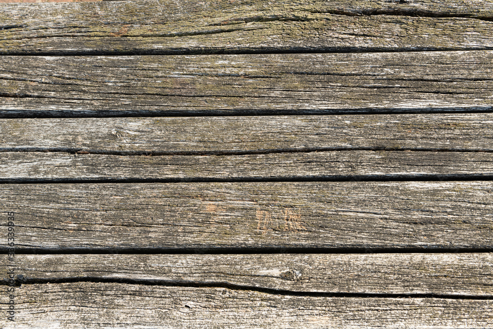 Weathered surface of an outside strong wooden table Weathered surface of an outside strong wooden table