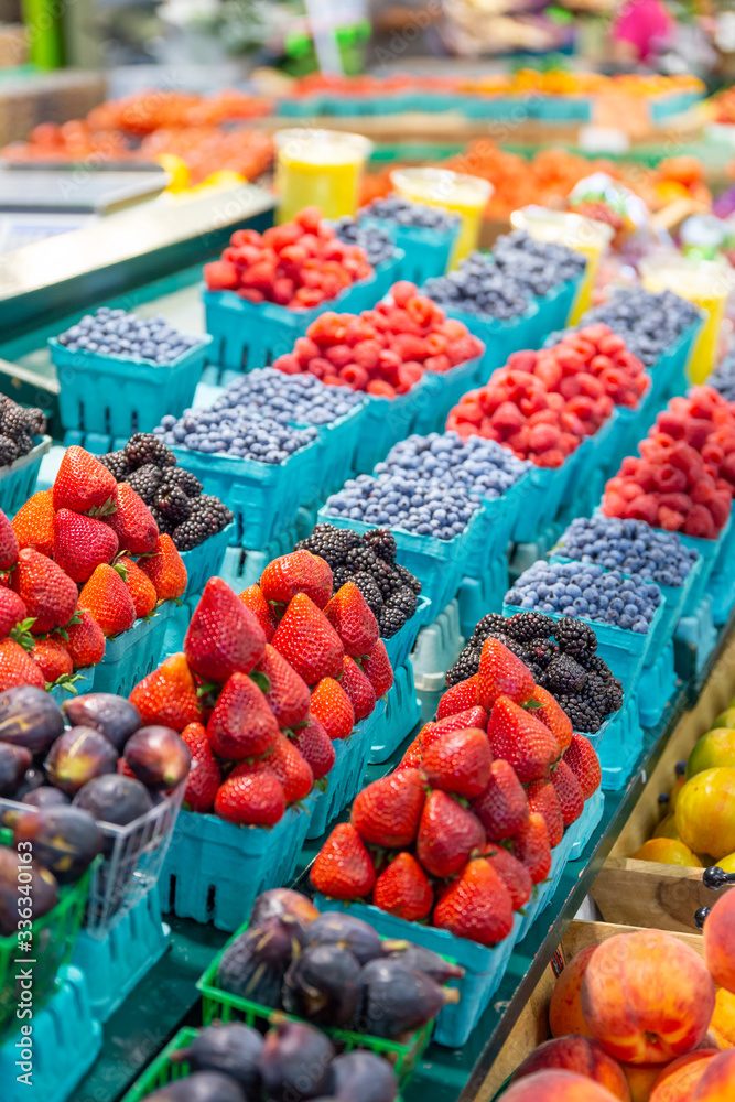 Variety of fresh fruit for sale on a farmers market stall