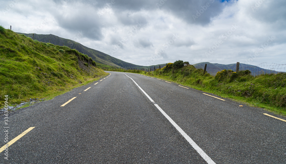 Panoramic landscape with a highway
 Empty mountain in County Kerry in Ireland.