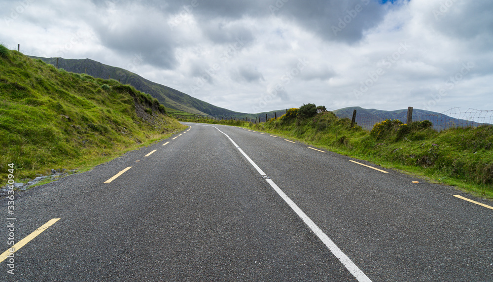 Panoramic landscape with a highway
Empty mountain in County Kerry in Ireland. Panoramic landscape with a highway
Empty mountain in County Kerry in Ireland.