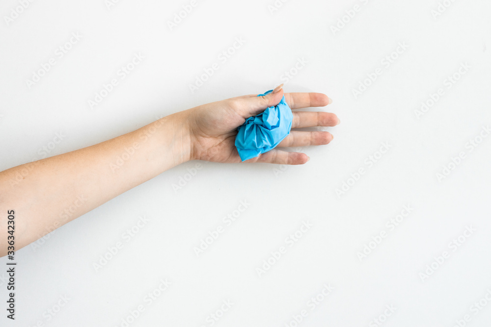Fototapeta premium Blue medical gloves on the white background. Coronavirus rules .