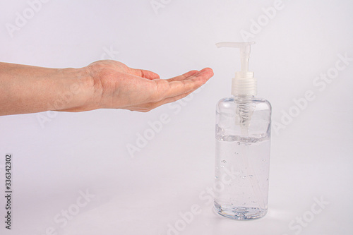 Male hand using hand skin sanitizer gel tube for washing hand. Close-up