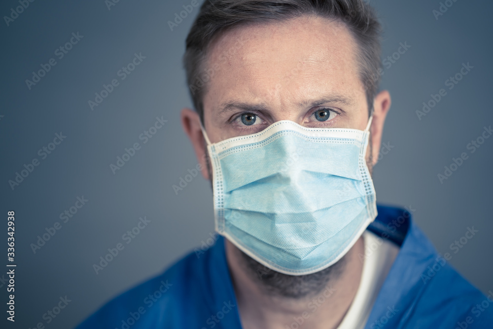 Male Doctor or Nurse Wearing Protective face medical Mask. Save lives from Covid-19 Outbreak Male Doctor or Nurse Wearing Protective face medical Mask. Save lives from Covid-19 Outbreak