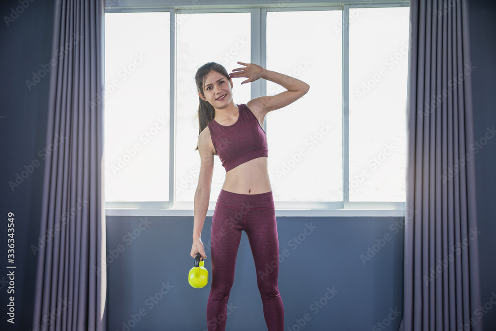 Slim young woman athlete workout in gym. Beautiful sporty woman workout in gym healthy lifestyle.