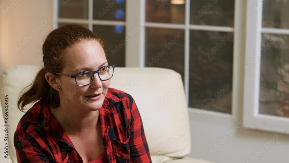 Close up of woman with glasses playing video games Close up of woman with glasses playing video games