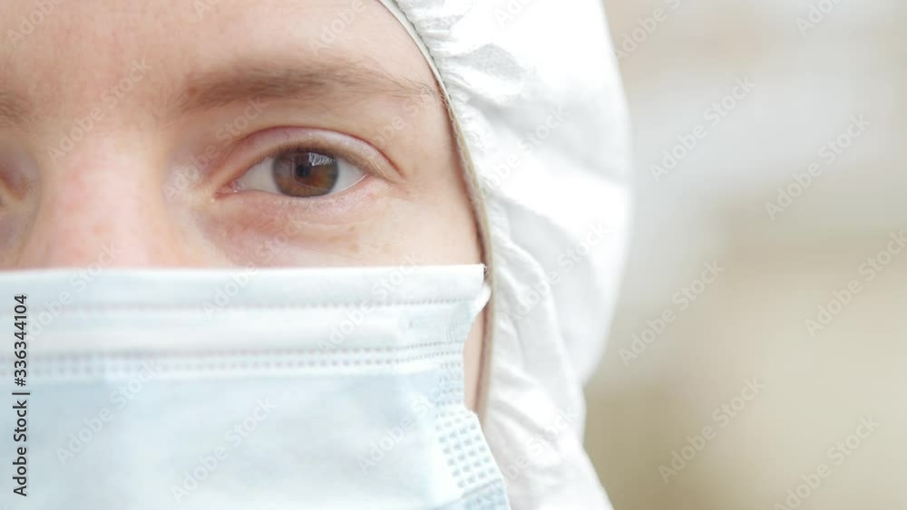 Healthcare worker with a mask on coveralls Healthcare worker with a mask on coveralls