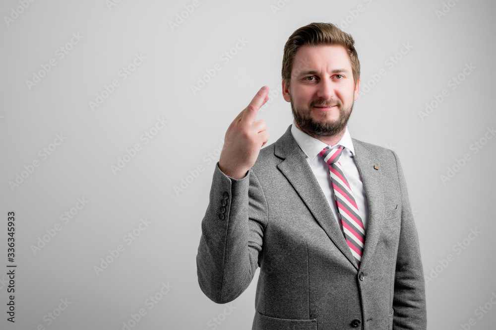 Portrait of business man wearing business clothes showing fingers crossed Portrait of business man wearing business clothes showing fingers crossed