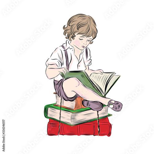 Little boy read book sitting on stack of books. Young intellectual. Preschool child