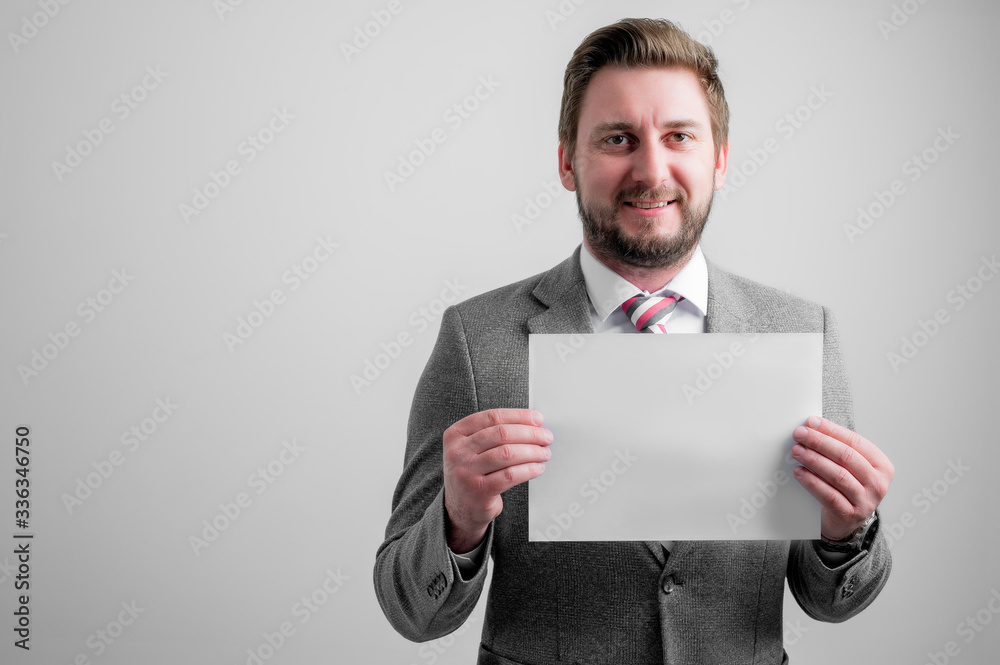 Portrait of smileing business man wearing business clothes holding white paper