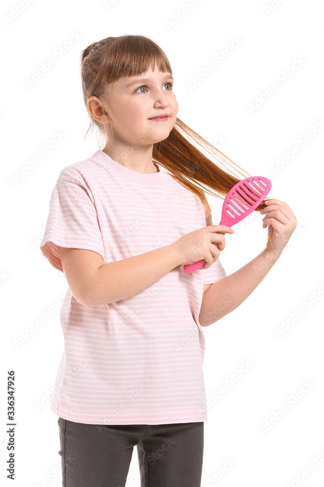 Little girl brushing hair on white background Little girl brushing hair on white background