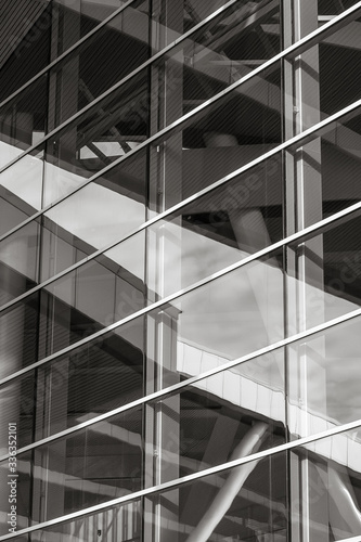 fragment of a building with large glass windows. Black and white photo