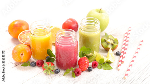 fruit juice- berry fruit, orange, kiwi, smoothie and straw