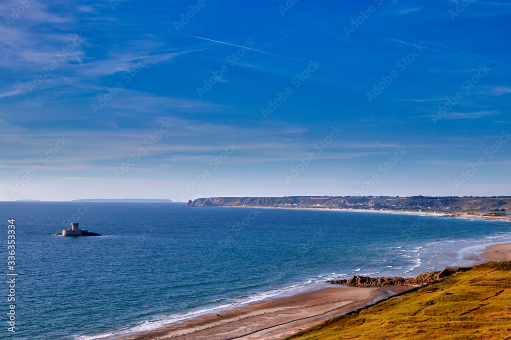 Image of St Ouens Bay looking North with La Rocco Tower and the shoreline. Jersey, Channel Islands