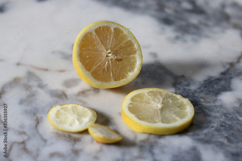 Sliced lemon over a marble countertop Sliced lemon over a marble countertop