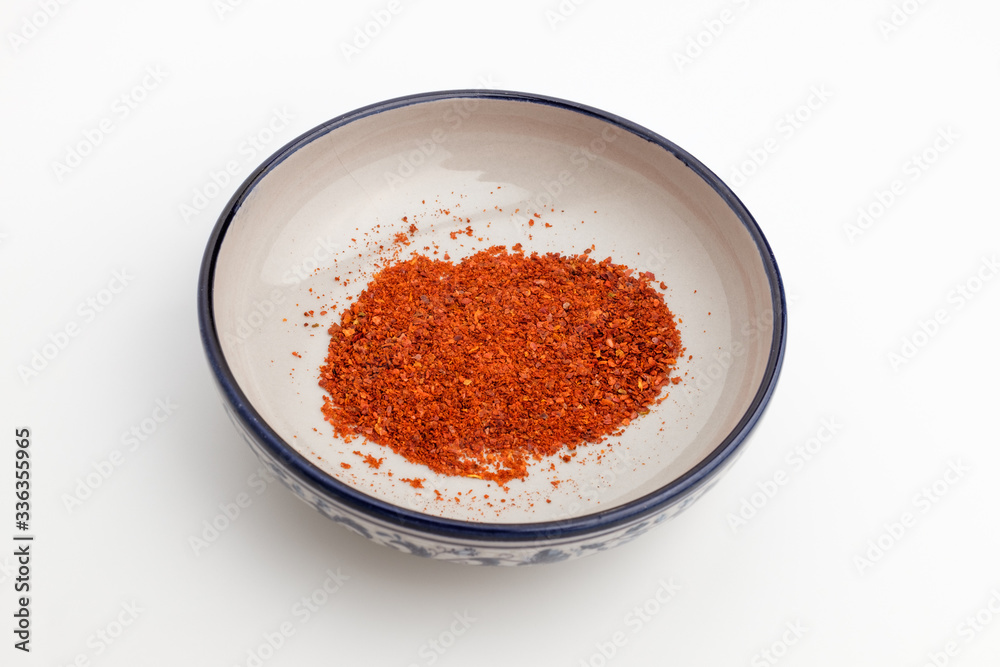 Red pepper powder on white background Red pepper powder on white background