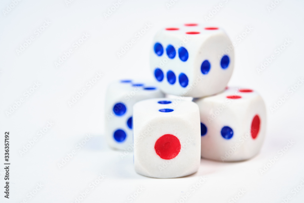 Four dice, cubes on a white background, space for text Four dice, cubes on a white background, space for text