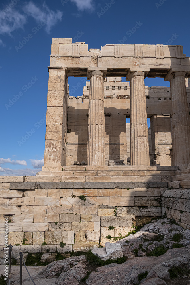 Ancient Greek ruins of Propylaea on a top of Acropolis hill in Athens. Acropolis - main tourist attraction of Athens. Greece.