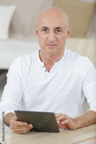 senior mature man using tablet pc