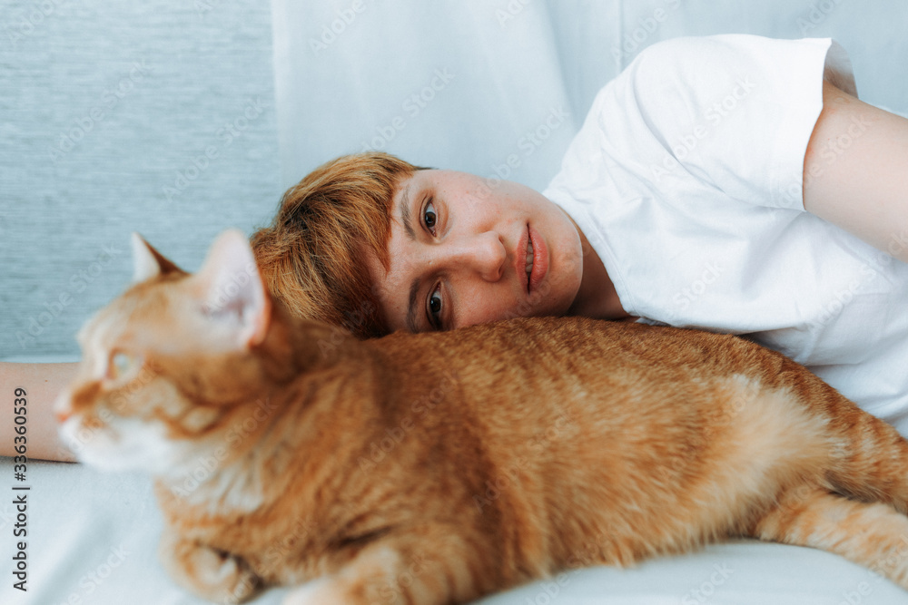 girl and ginger cat