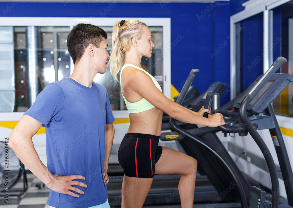 Fototapeta premium Confident trainer posing at gym