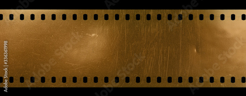 blank scratched 35mm cine filmstrip on black background.