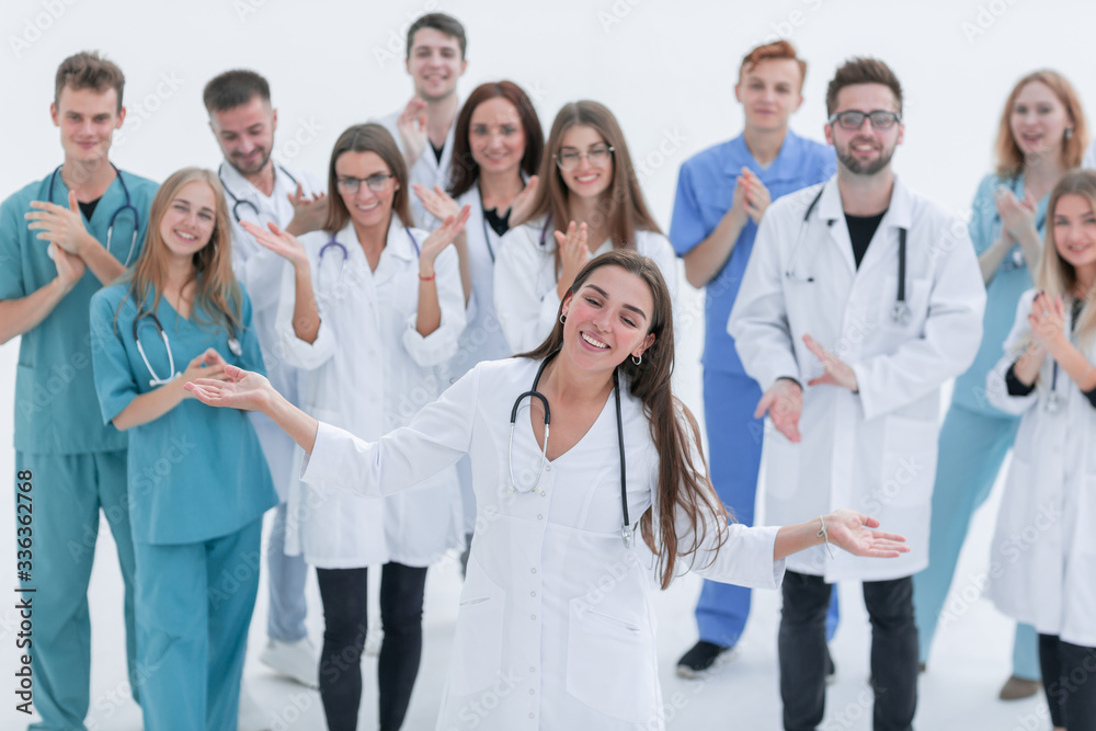 large group of medical professionals applauding their leader large group of medical professionals applauding their leader