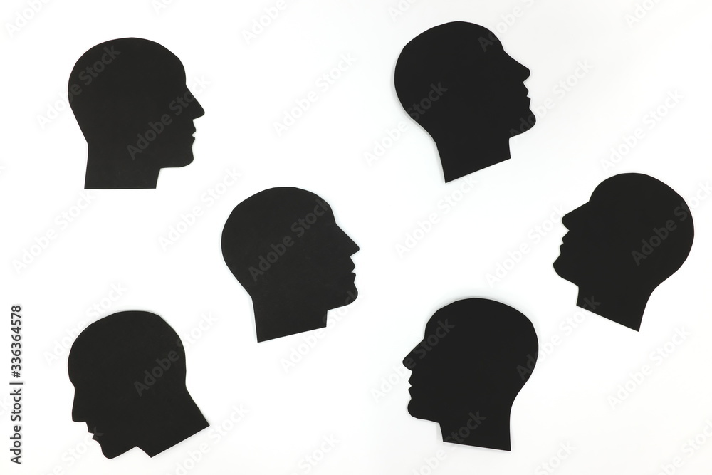 A set of black male head profile silhouette isolated in white background. Stress and depression concept.