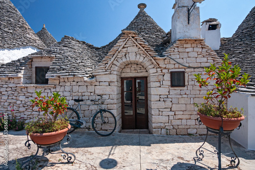 Panoramic view of the streets with the characteristic trulli of the town of Alberobello in Puglia, Italy. photo