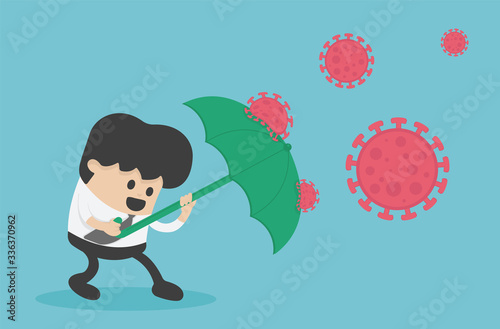Green umbrella protecting young businessman immune  coronavirus
