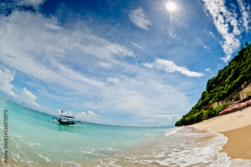 A fishing boat anchored in a deserted lagoon in Bali, Indonesia.