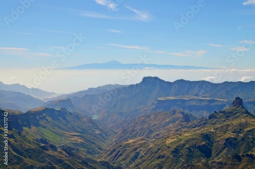 Aerial view on Gran Canaria mountainscape towards neigbour island Tenerife with Mount Teide